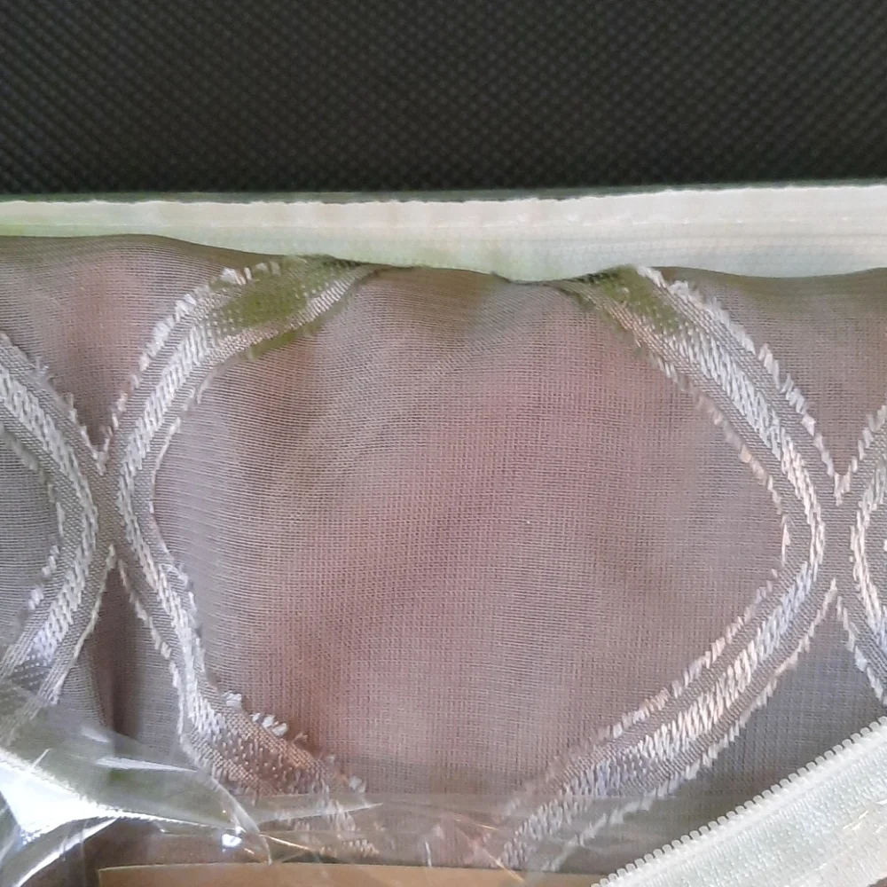 Sheer grommet panel window covering